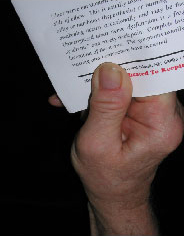 A person holding a piece of paper